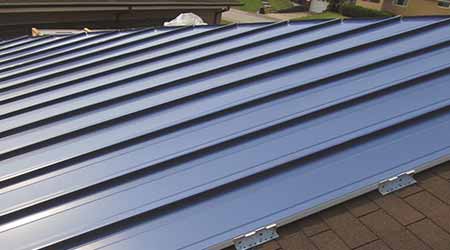 Metal System Recovers Damaged But Functional Shingled Roofs: Tremco