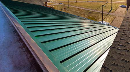 Metal Roof System Helps Prevent Wind Uplift: The Garland Co. Inc.